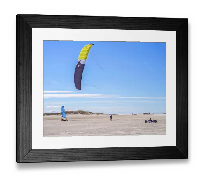 Framed Print : Recreational sport Beach kiting on the edge of the national park and UNESCO World Heritage Site, designated kite area, kite buggy steered with both feet, driver's seat with kiter between rear axle and front wheel, high speed, westerly winds