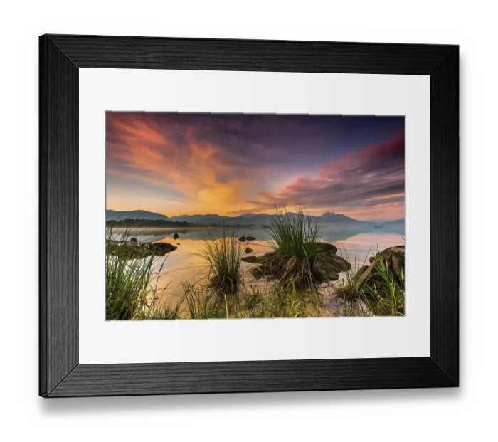 Framed Print : Forggensee with reflection of the cloudy sky and the Allgaeuer mountains in the background at sunrise Framed Print : Forggensee with reflection of the cloudy sky and the Allgaeuer mountains in the background at sunrise