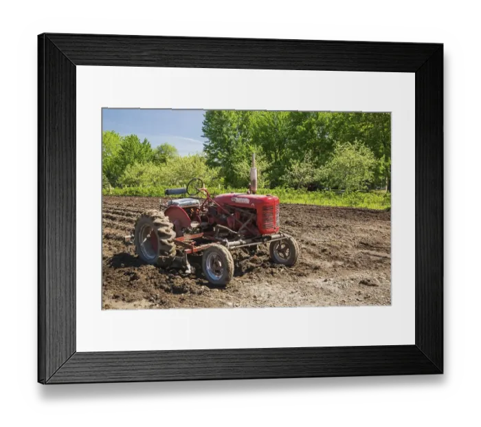 Framed Print : Red McGormick Farmall Super A tractor in plowed agricultural field