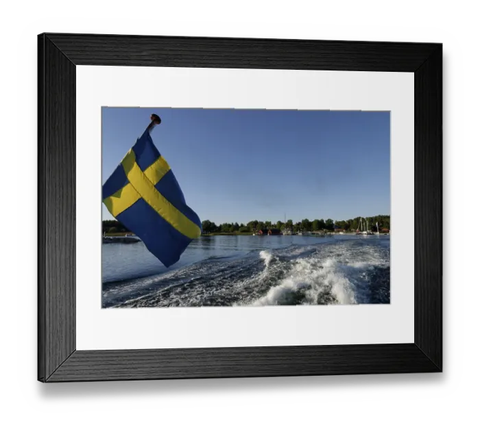 Framed Print : Ship with Swedish flag off Husaroe