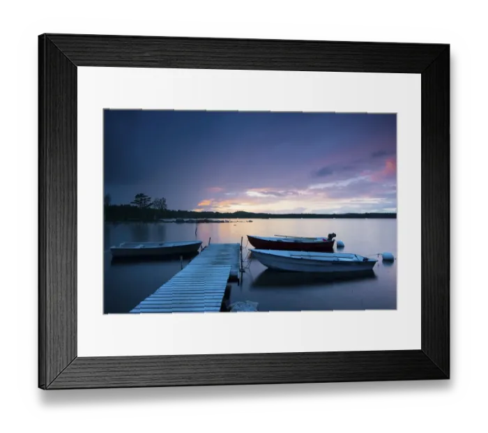 Framed Print : Boats at the jetty at sunset on lake Skaervsjoe