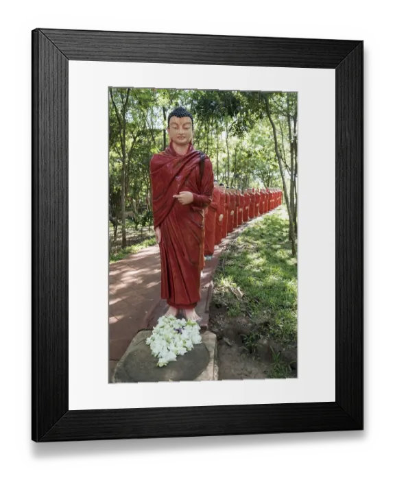 Framed Print : Statues of monks walking behind Buddha