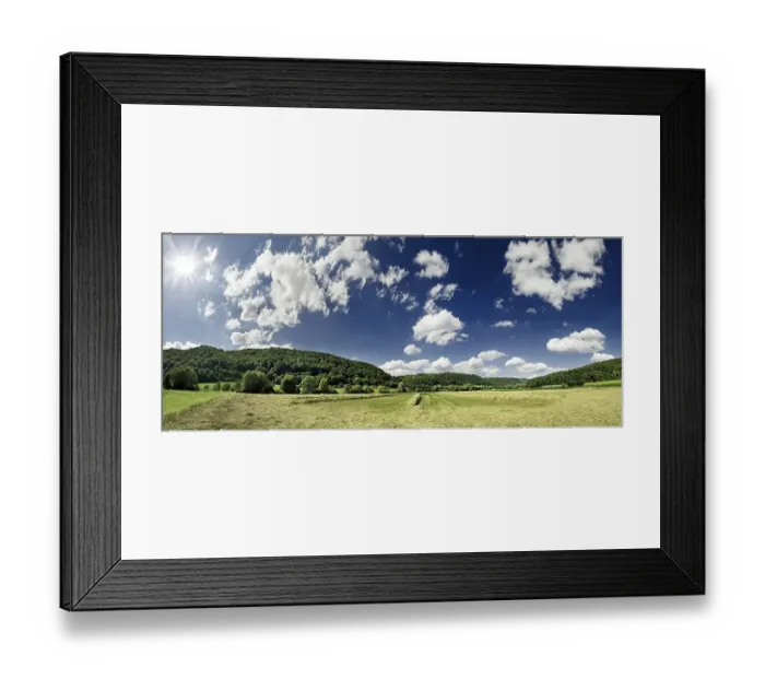 Framed Print : Panoramic view of a hay meadow and cloudy sky