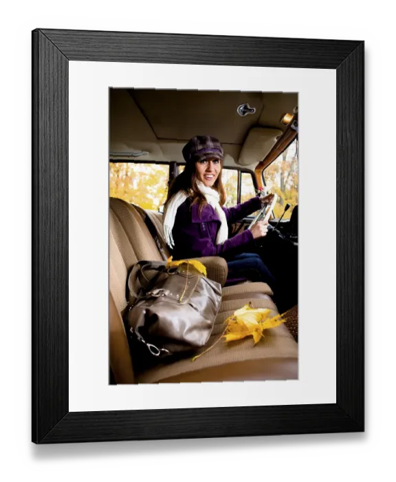 Framed Print : Young woman driving a vintage car Framed Print : Young woman driving a vintage car