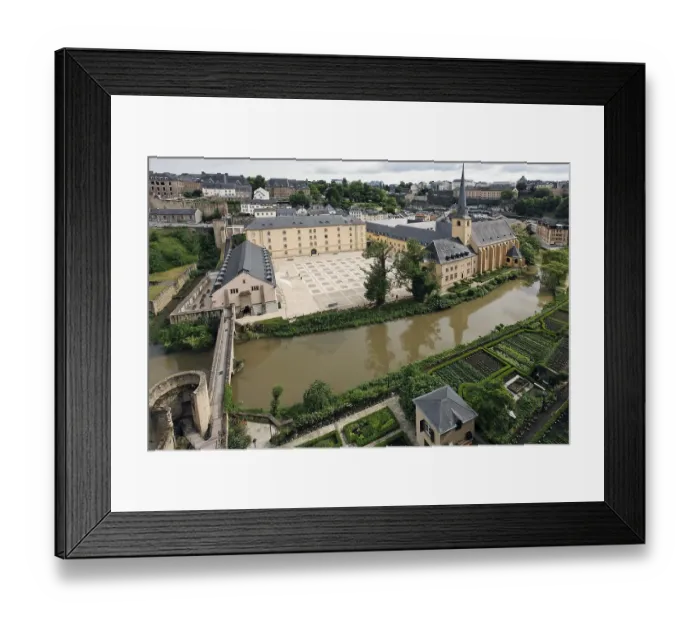 Framed Print : View from the Bockfelsen cliffs towards the Grund district with Neumuenster Abbey and gardens on the Alzette River