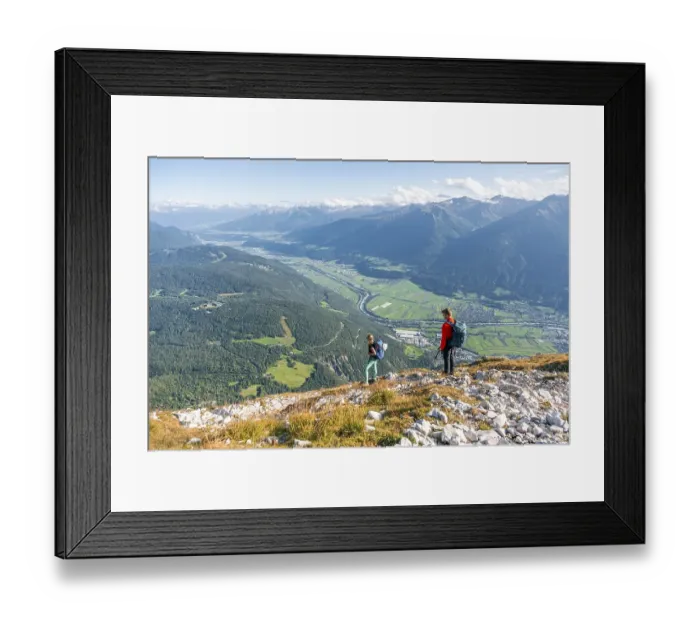 Framed Print : Hikers descending, Inn valley and mountain landscape