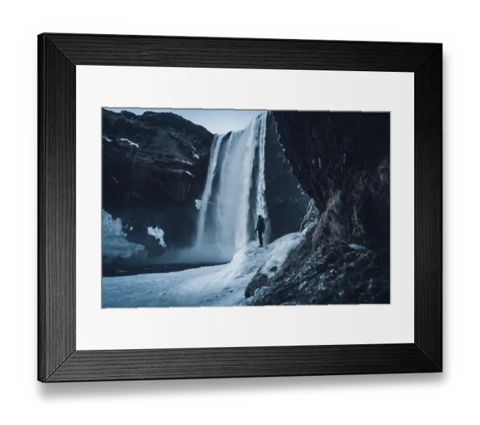 Framed Print : Silhouette of woman in winter in Iceland under Skogafoss waterfall Framed Print : Silhouette of woman in winter in Iceland under Skogafoss waterfall