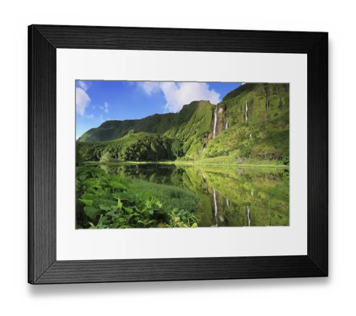 Framed Print : Waterfalls on the forested slope of a volcano reflected in a lake