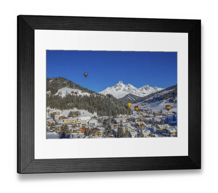 Framed Print : Hot air balloons, Filzmoos in winter with mountain peak Bischofsmuetze
