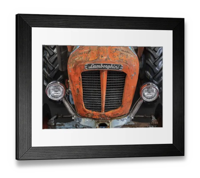 Framed Print : Close-up of an old Lamborghini tractor with brand emblem