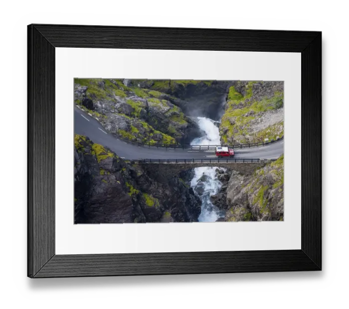 Framed Print : Single car on the mountain road Trollstigen