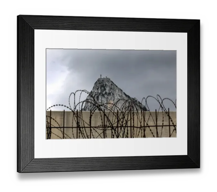 Framed Print : Fence on Spanish territory, just in front of the British territory of Gibraktar