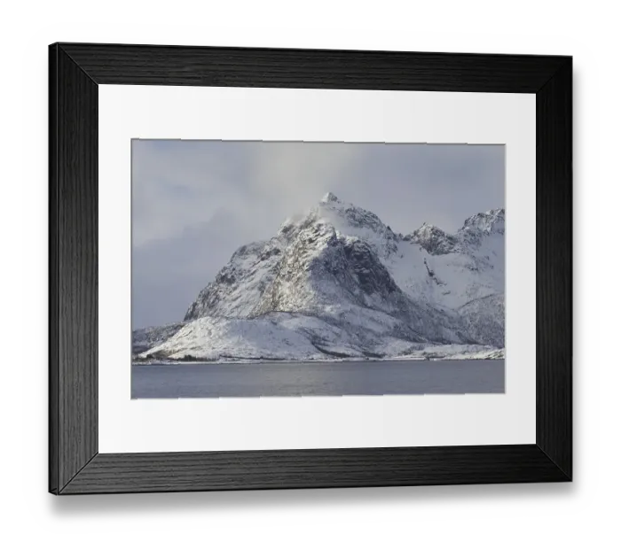Framed Print : Snow covered mountains along the fjord Raftsund in winter