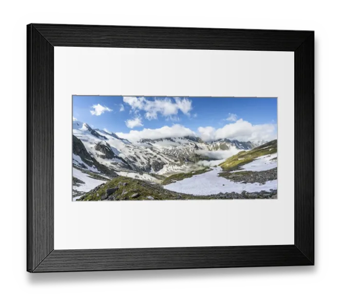 Framed Print : Mountain landscape with snow fields and high fog in the valley
