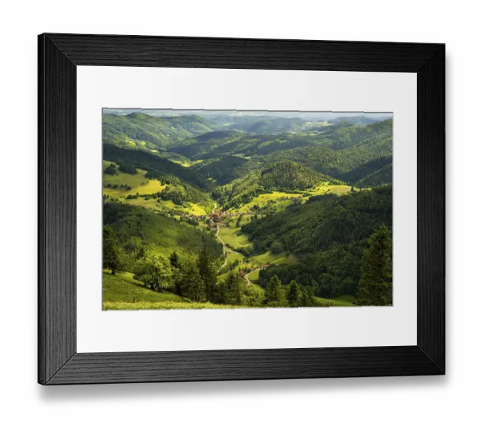 Framed Print : Hilly landscape with a village