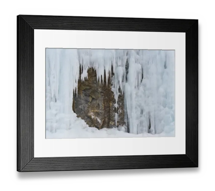Framed Print : Icicles in front of a rock face