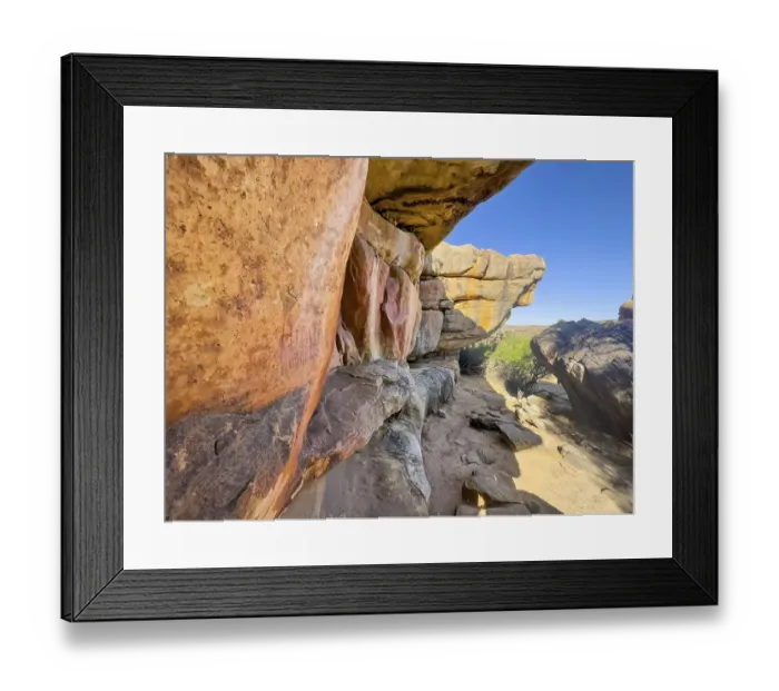 Framed Print : Prehistoric depiction of woman on a rock