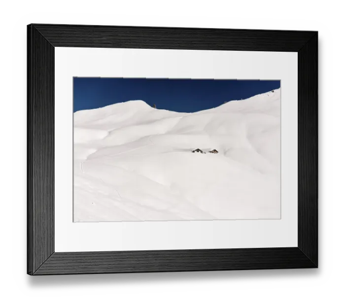 Framed Print : Mountain chalet in snow-covered landscape