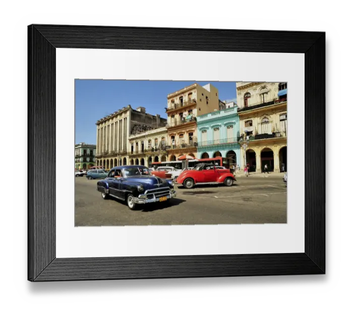 Framed Print : Vintage car in front of buildings with colourful facades Framed Print : Vintage car in front of buildings with colourful facades
