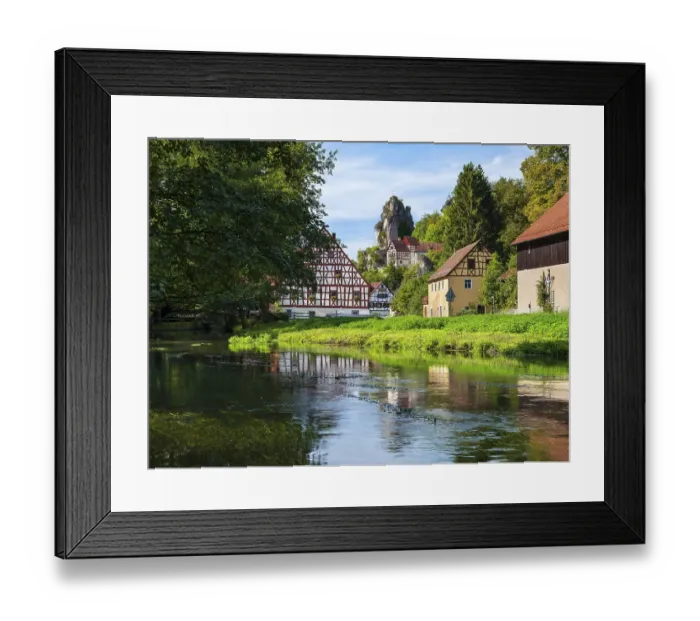 Framed Print : Zechenstein rock formation and half-timbered houses on the Puettlach river