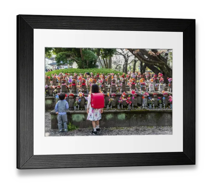 Framed Print : Two schoolchildren in front of Jizo statues with red caps Framed Print : Two schoolchildren in front of Jizo statues with red caps