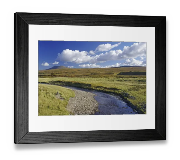 Framed Print : Idyllic river landscape with mountains in the background under a blue sky Framed Print : Idyllic river landscape with mountains in the background under a blue sky