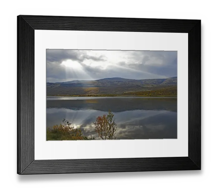 Framed Print : A calm lake with mountains in the background Framed Print : A calm lake with mountains in the background
