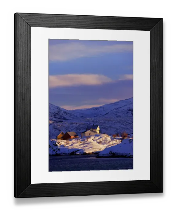 Framed Print : Fishing village beside a fjord with wintry mountains