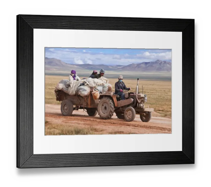Framed Print : Tibetan pilgrims on a tractor on the road from Gerze to Tsochen