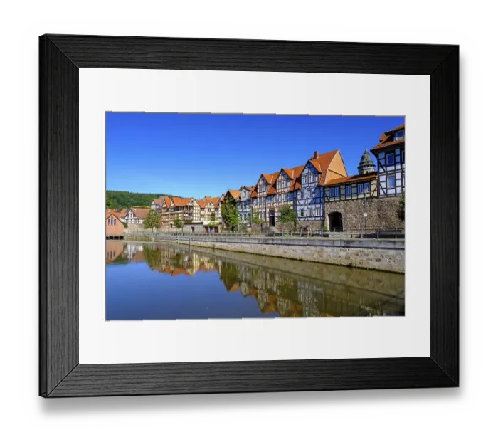 Framed Print : Half-timbered houses on the River Fulda