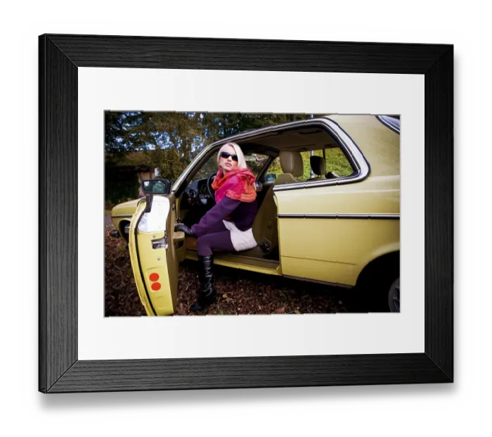 Framed Print : Young woman in a post-war classic car
