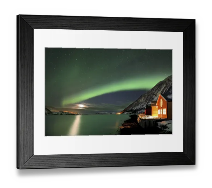 Framed Print : Red fishing huts on the fjord in winter with Northern Lights
