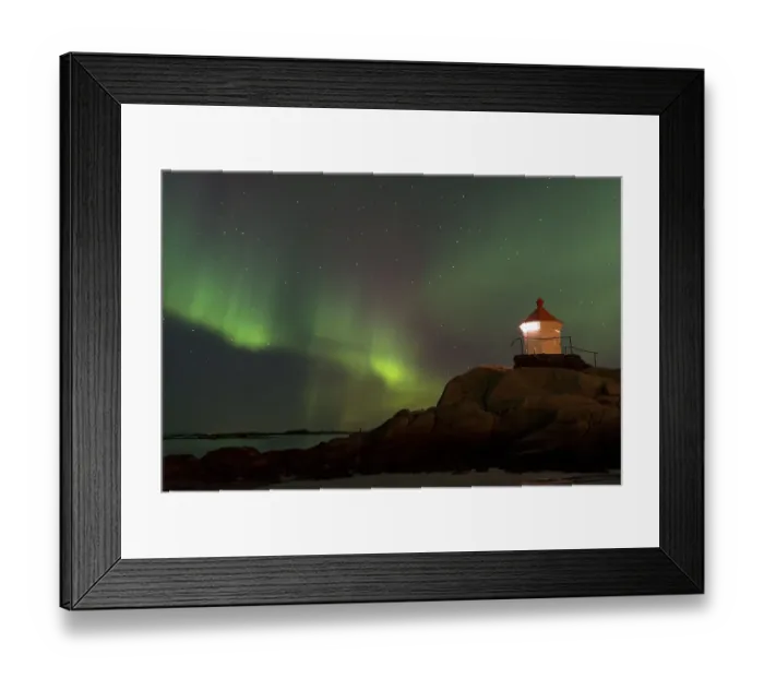 Framed Print : Northern Lights over a lighthouse