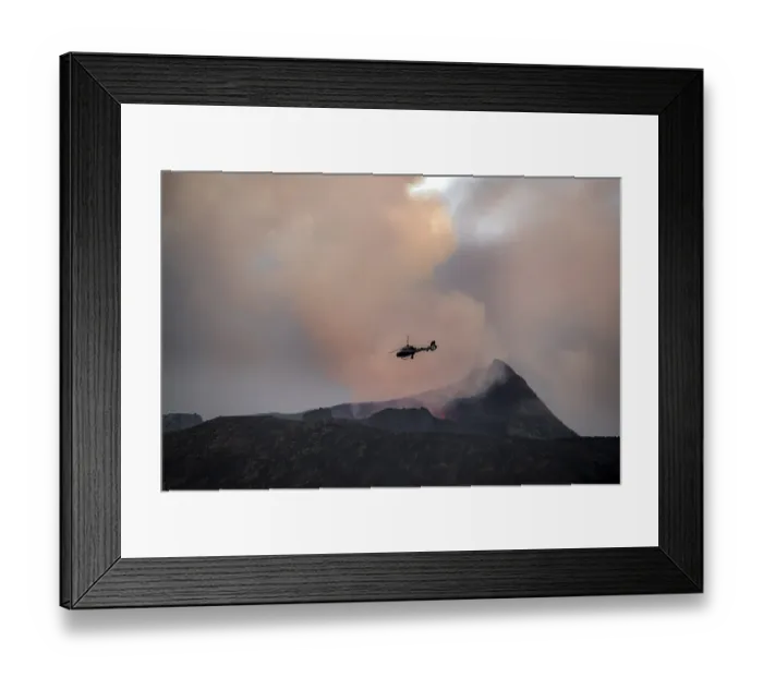 Framed Print : Helicopter flying over smoking active volcanic crater Framed Print : Helicopter flying over smoking active volcanic crater