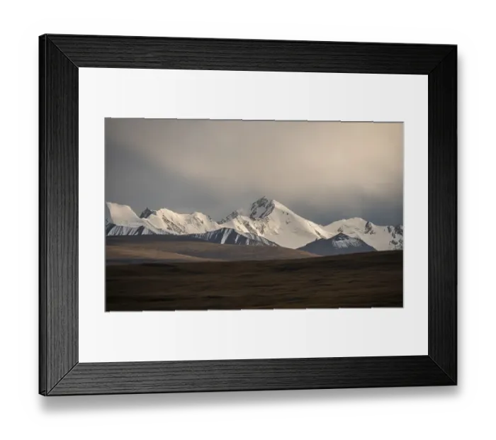 Framed Print : Glaciated and snow-capped mountains in the evening light