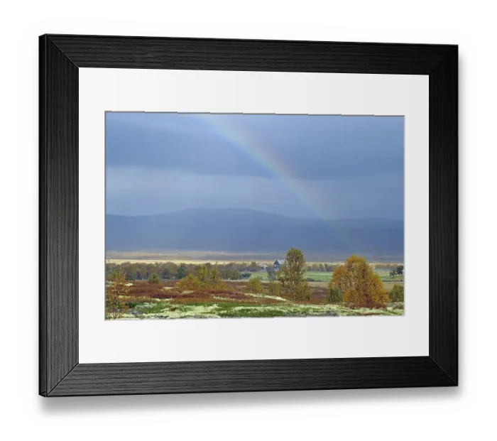 Framed Print : Picturesque landscape with rainbow over autumn coloured trees and mountains in the background Framed Print : Picturesque landscape with rainbow over autumn coloured trees and mountains in the background