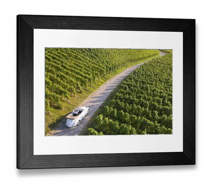 Framed Print : UAV recording, businessman in a vintage car