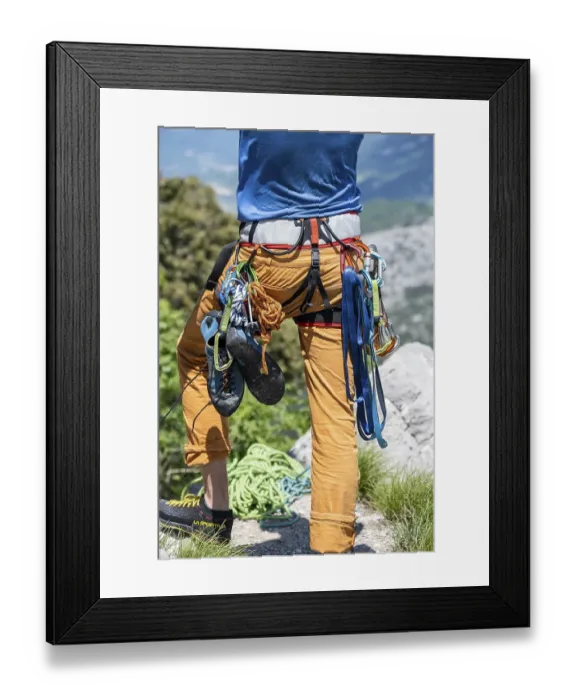 Framed Print : Climber with climbing pants, harness Framed Print : Climber with climbing pants, harness