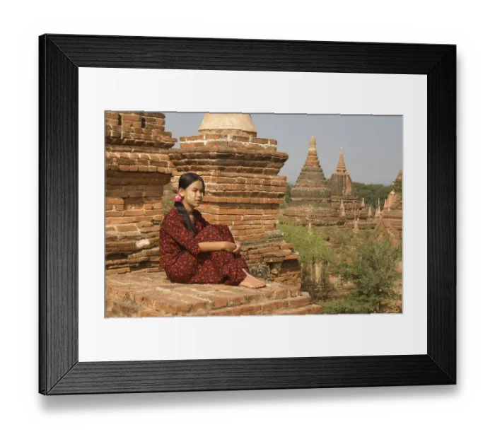 Framed Print : Young Burmese woman on the roof of a temple