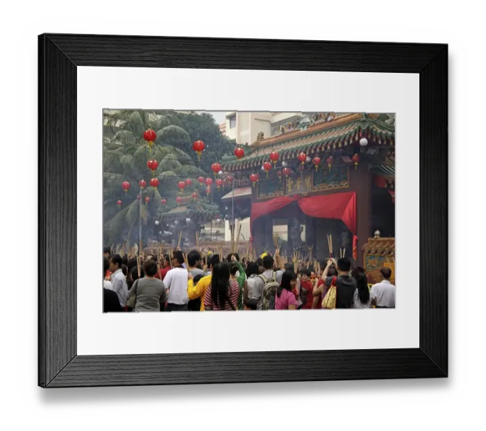 Framed Print : Chinese New Year ceremony with incense sticks in front of the buddhist Kwam Im Tong Hood Che temple in Singapore