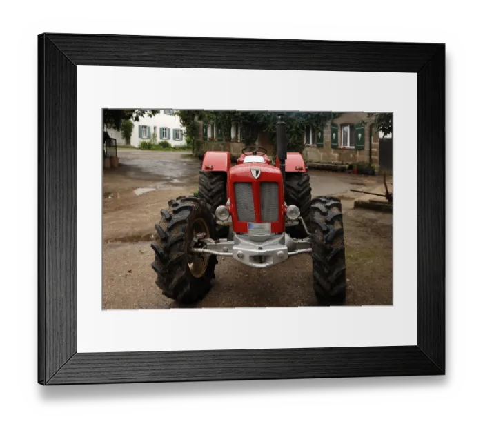 Framed Print : Vintage Schlueter tractor on a farm