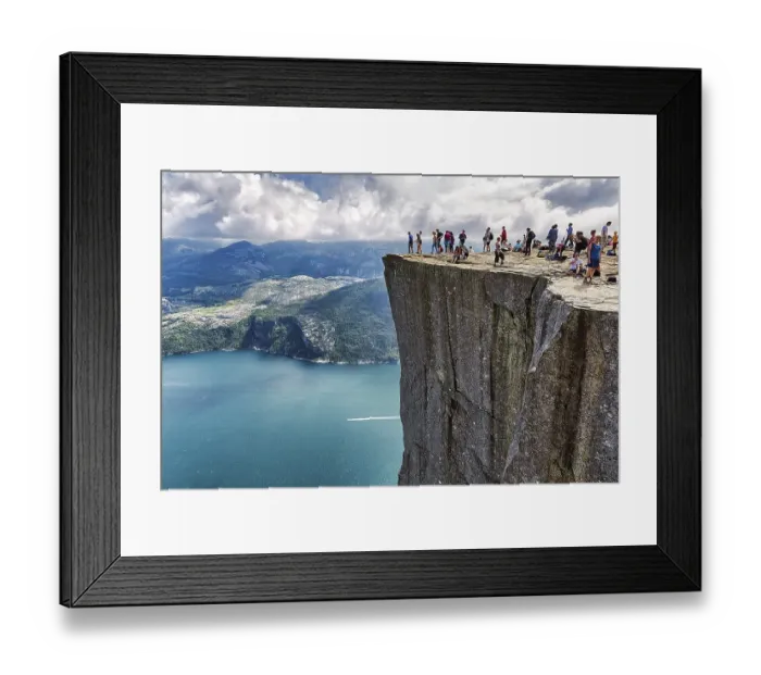 Framed Print : Hiker on rocky peak Preikestolen