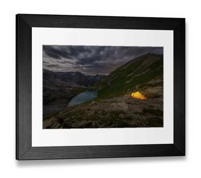 Framed Print : Tent in mountainous landscape with Lake Guffelsee in moonlight and cloudy sky Framed Print : Tent in mountainous landscape with Lake Guffelsee in moonlight and cloudy sky