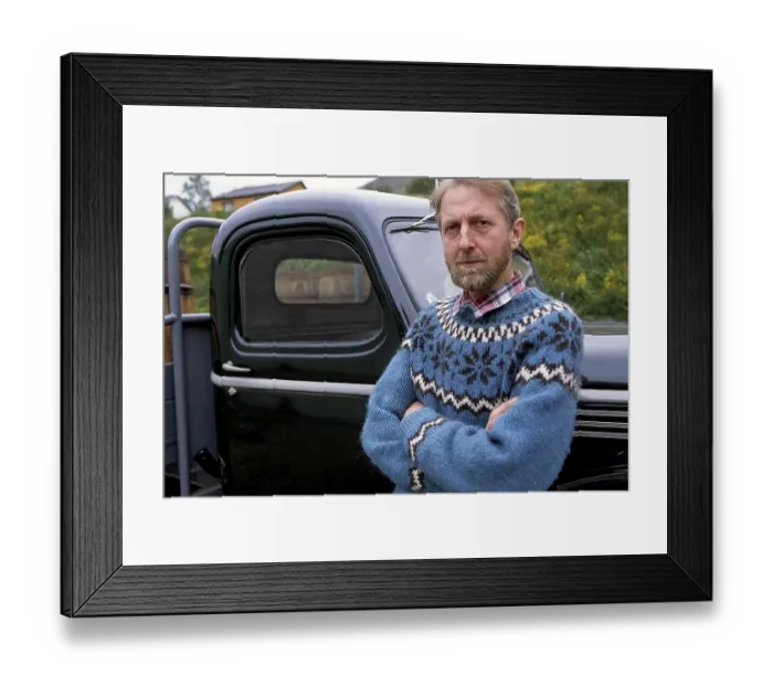 Framed Print : Man in Icelandic sweater in front of oldtimer