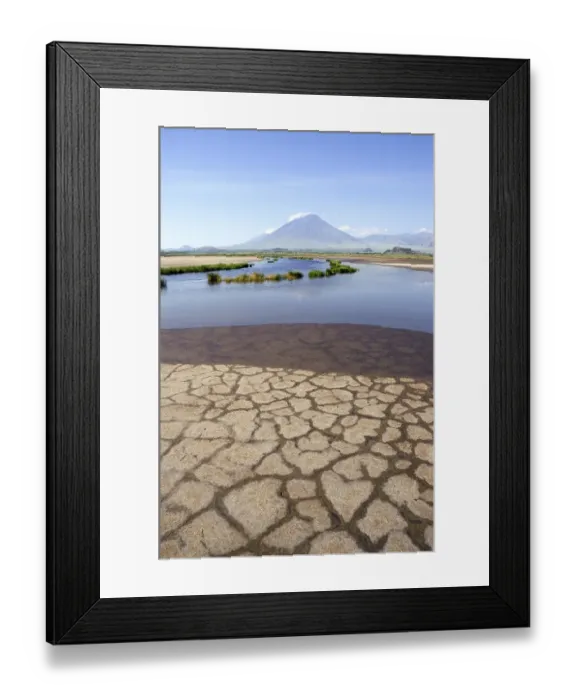 Framed Print : Shore of Lake Natron, Oldoinyo Lengai volcano at back
