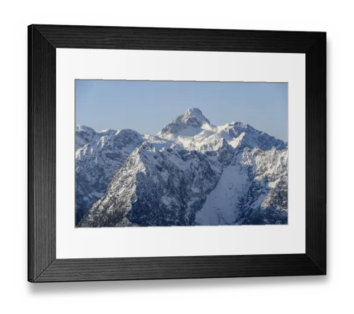Framed Print : Steep rocky mountain peaks with snow