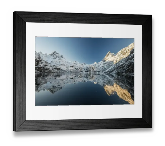 Framed Print : Snow covered mountains reflecting in the Trollfjord