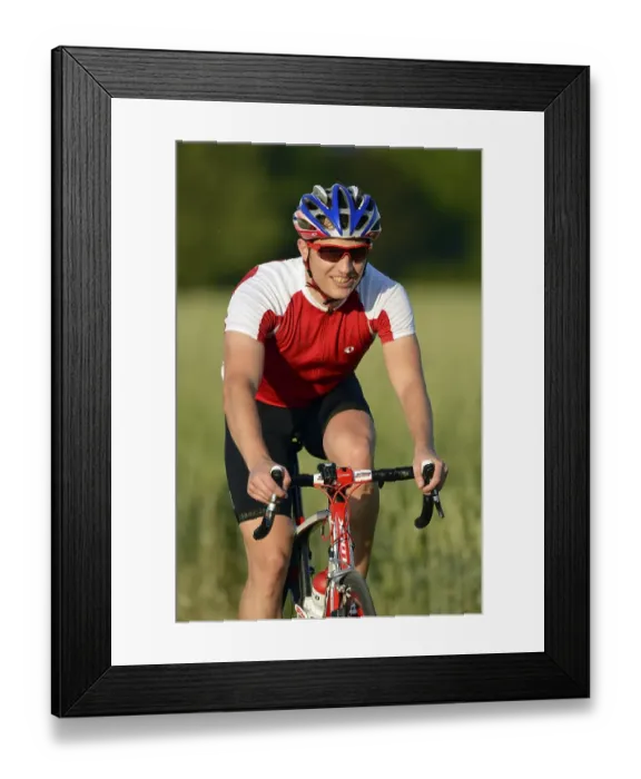 Framed Print : Racing cyclist riding a bicycle Framed Print : Racing cyclist riding a bicycle