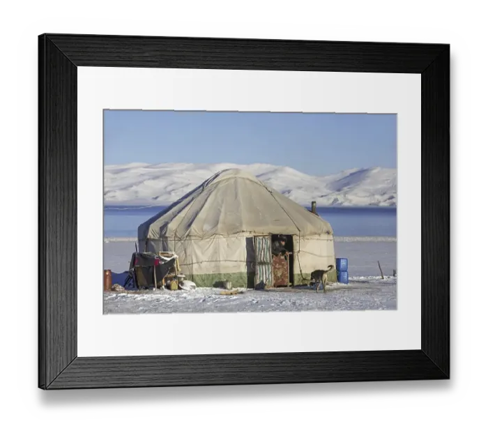 Framed Print : Kyrgyz man in door opening of traditional yurt in the snow along Song Kul