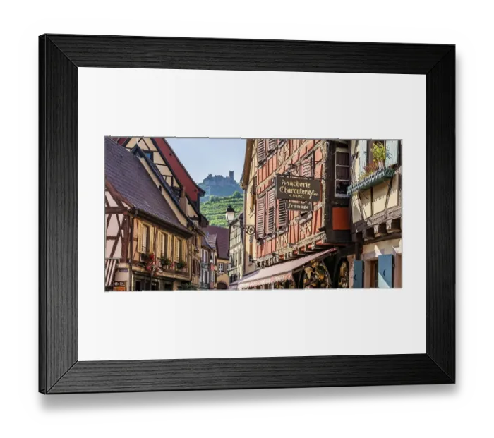 Framed Print : Half-timbered houses in the old town in front of the rock castle of Saint Ulrich